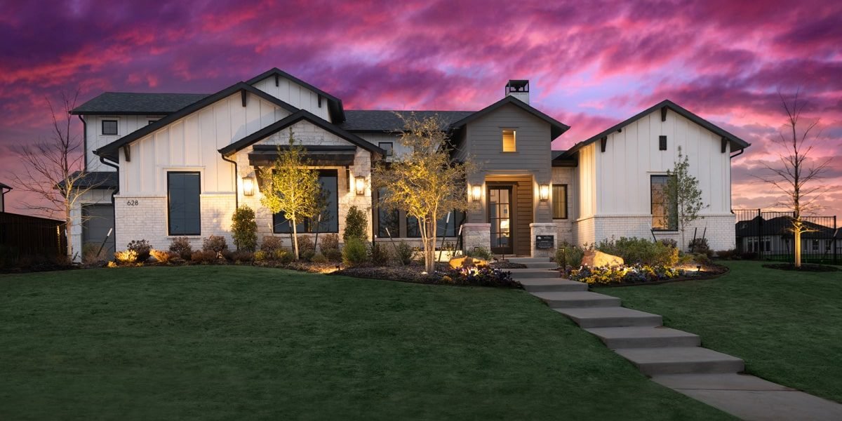 A modern house with a landscaped front yard in The Vines, Haslet, Texas.